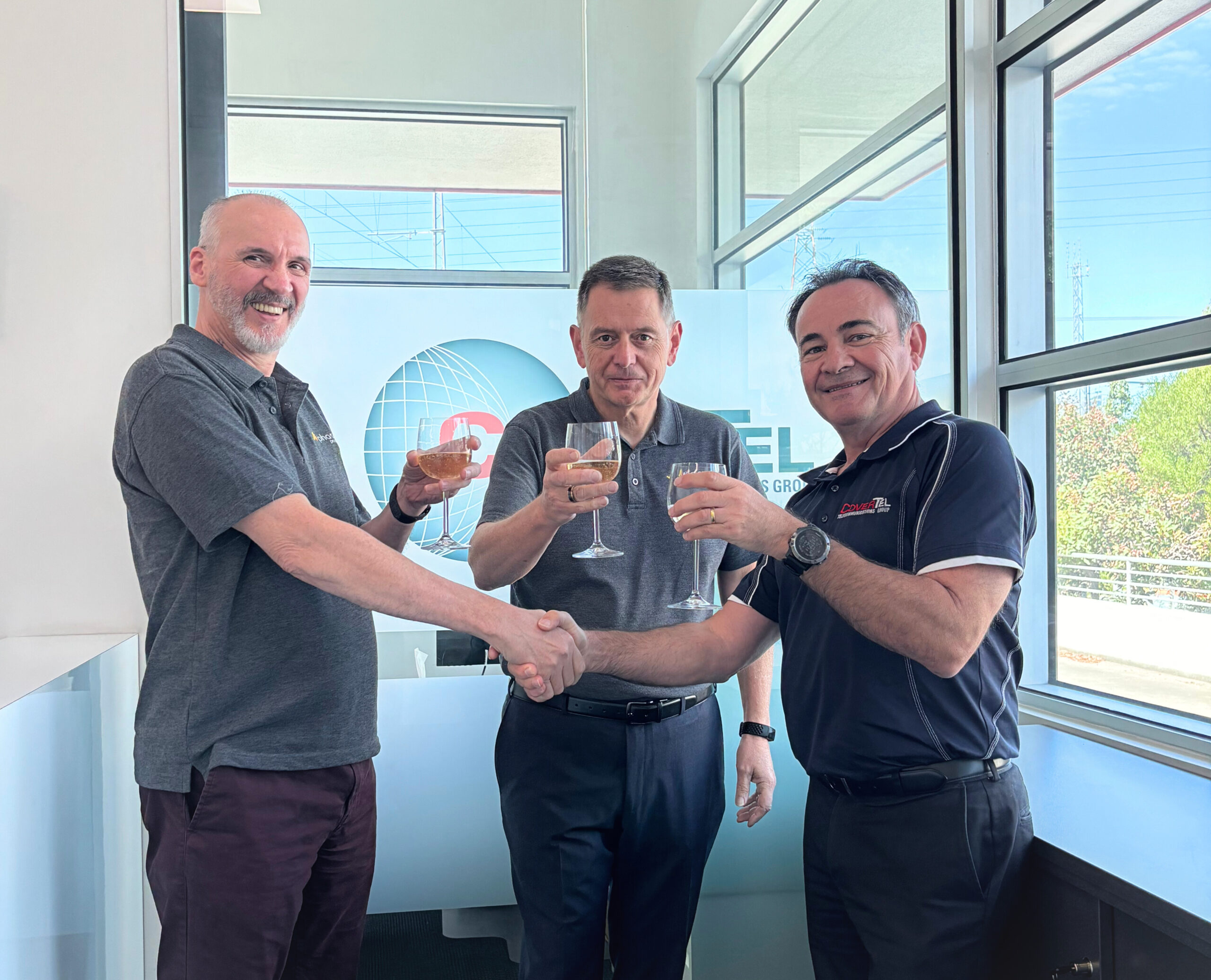 Bruno, Frank, and John raise a toast as Phase Pacific and CoverTel join forces.